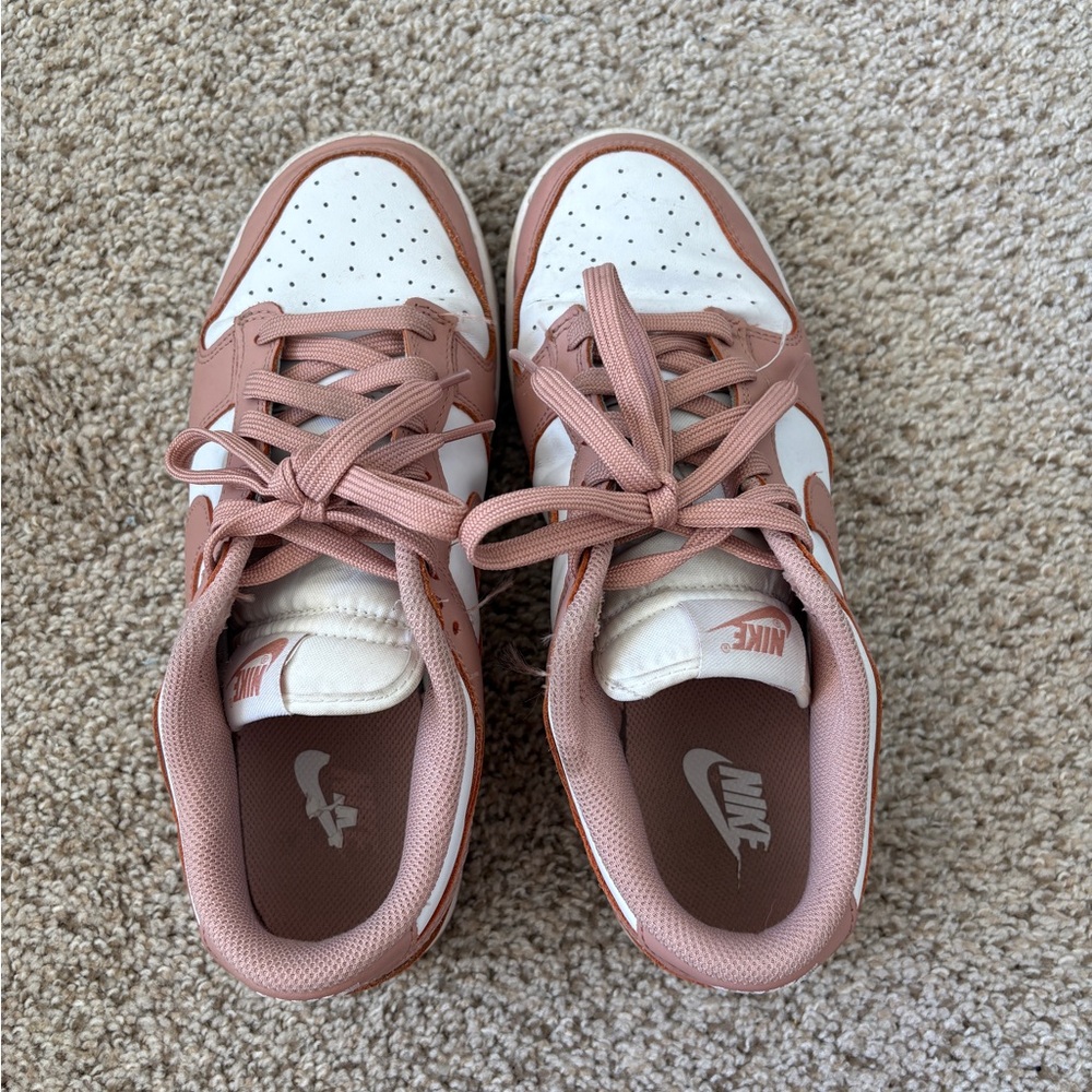 Women’s rose gold Nike sneakers